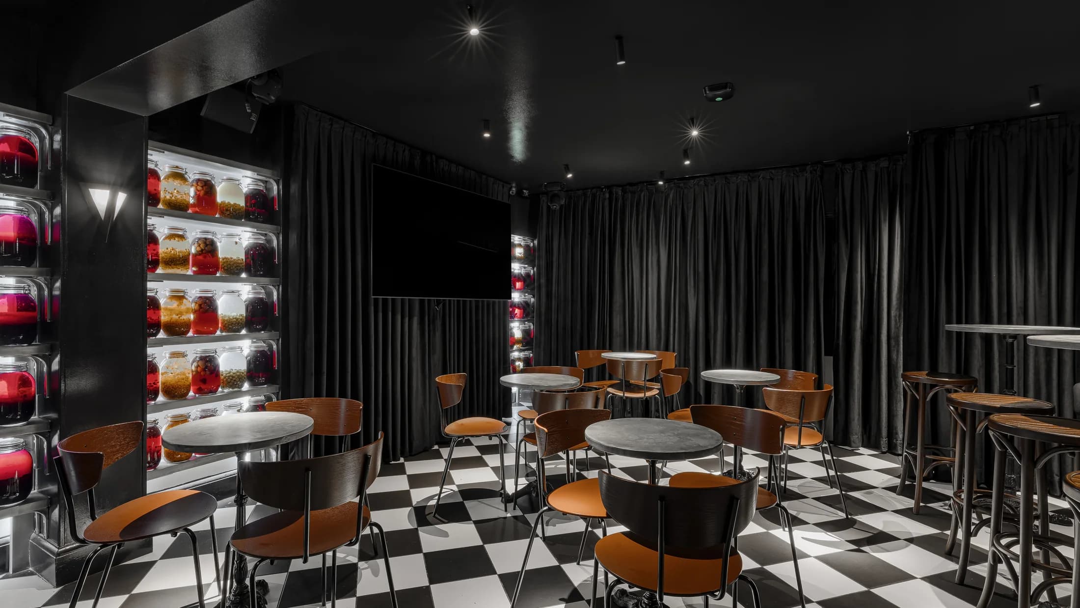 Screens and seating in the ZIMA karaoke bar