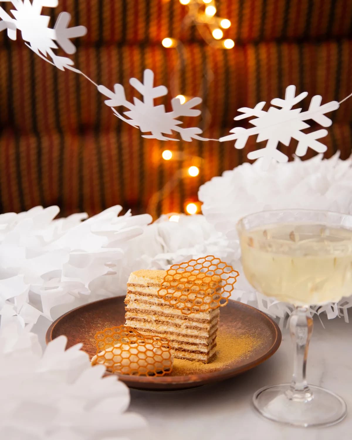 Napoleon layer cake with a glass of dessert wine