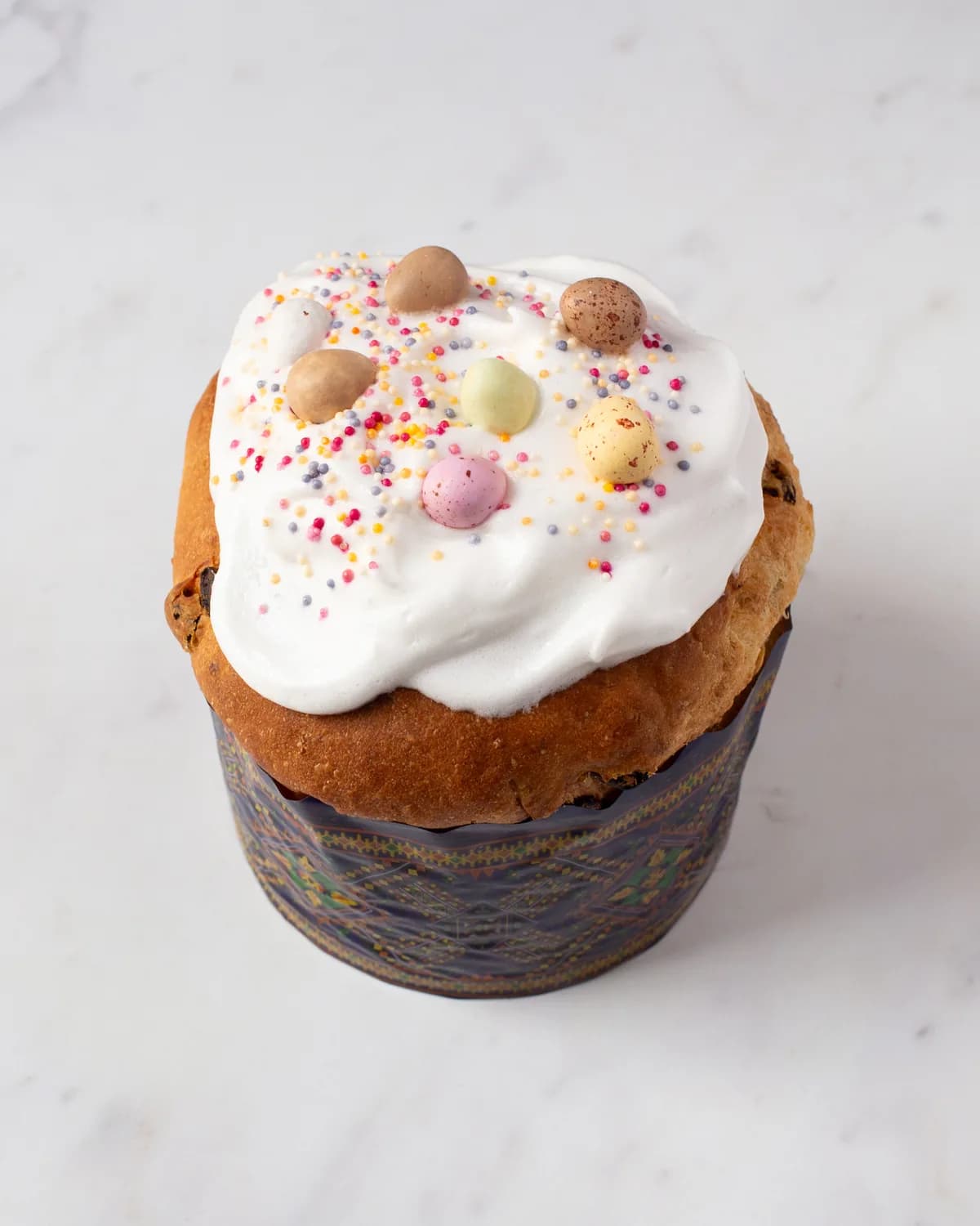 A kulich decorated with sugar flowers