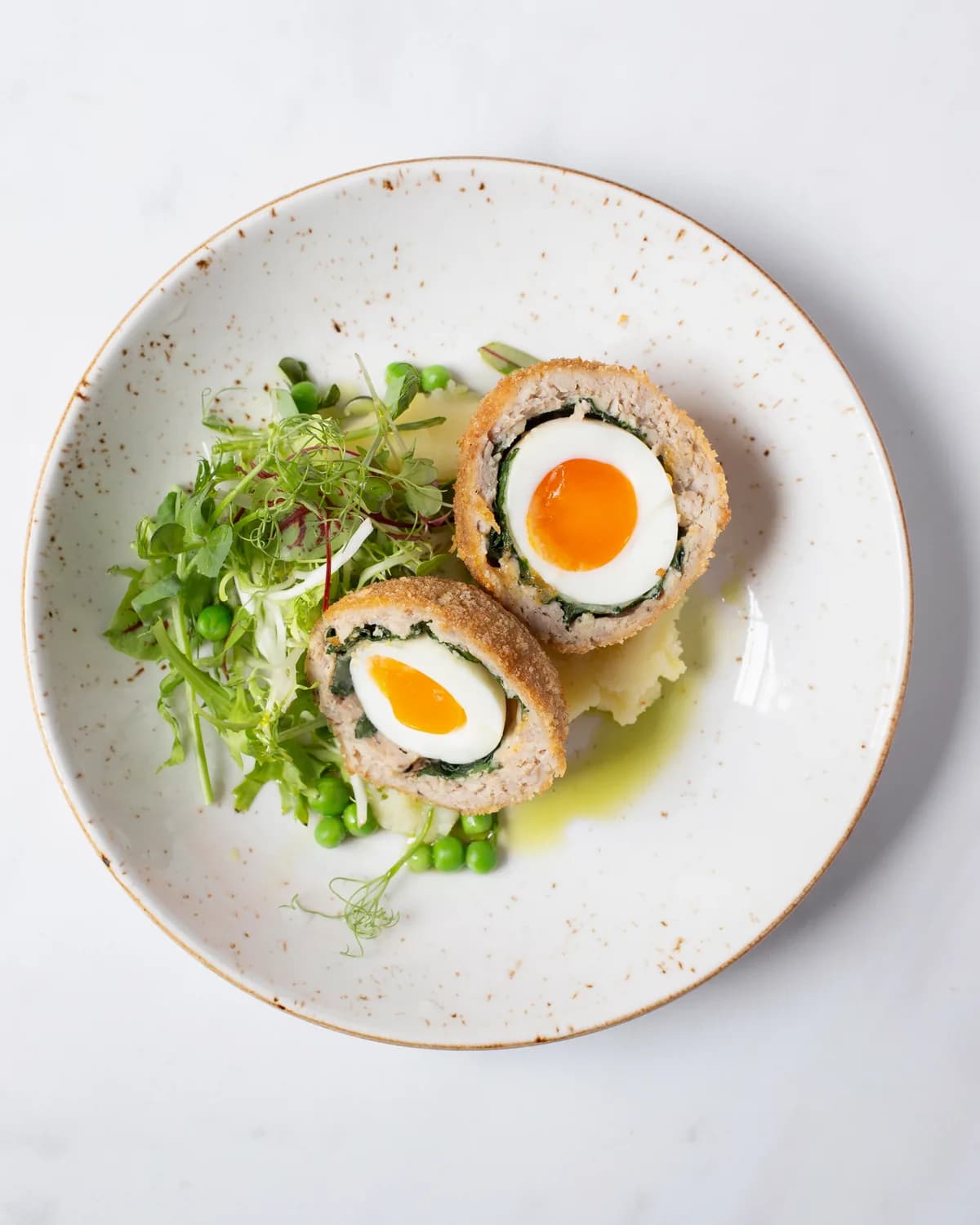 Scotch egg made with cured salmon, cut in half