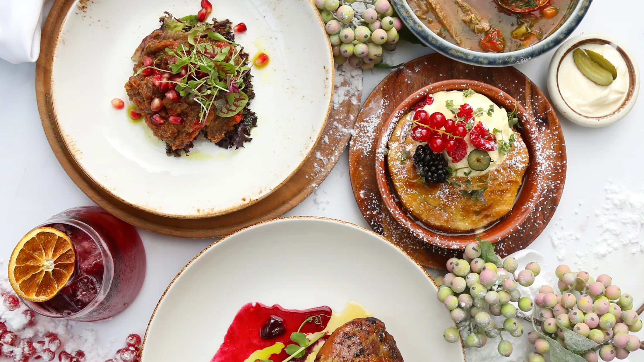 Overhead view of a ZIMA table with starters, mains and caviar