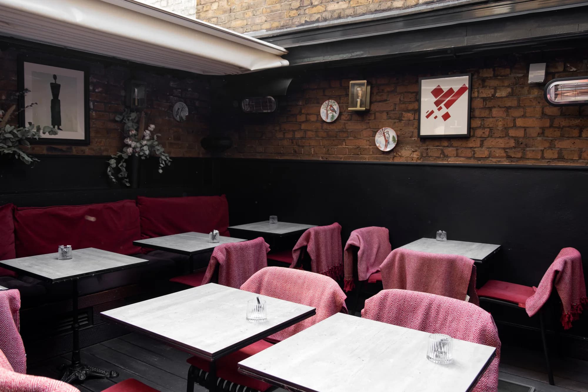 Marble tables in the Laika room at ZIMA